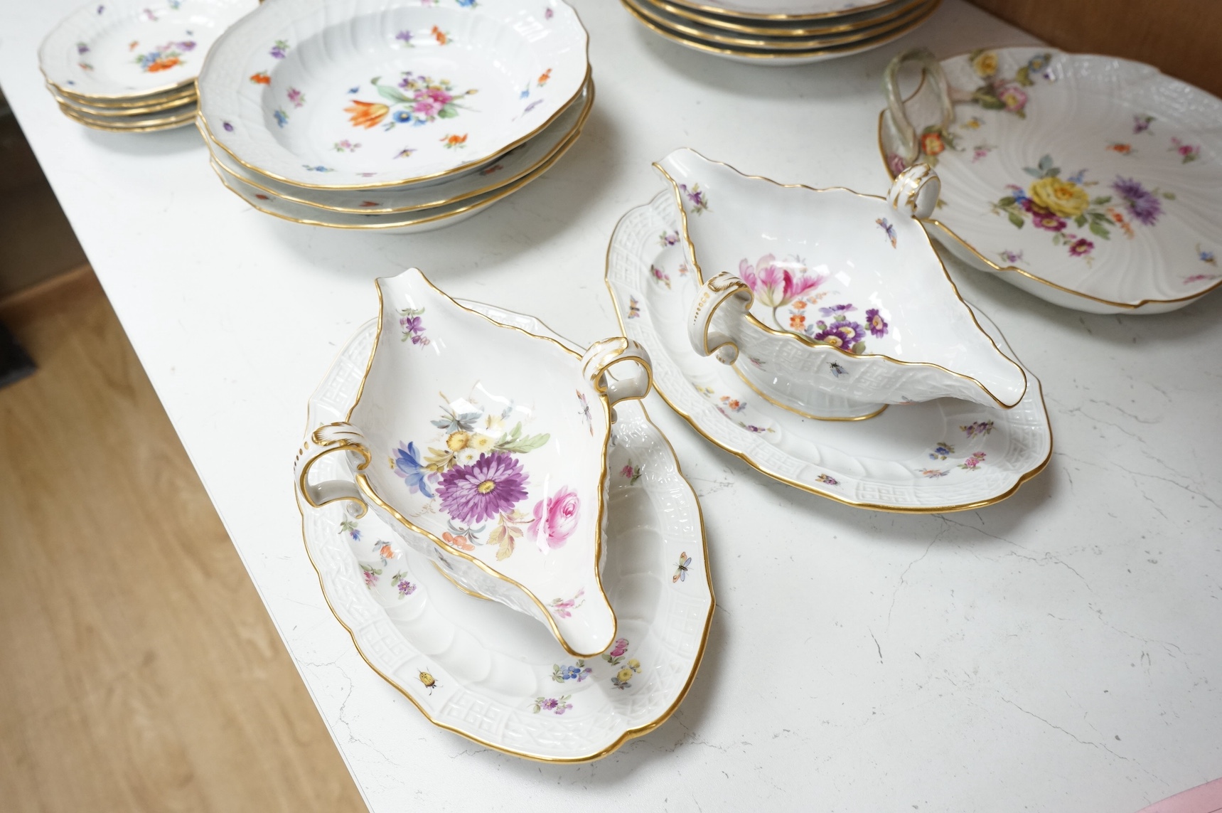 A 19th century Meissen mostly ‘New Brandenstein’ part dinner service. Condition - good